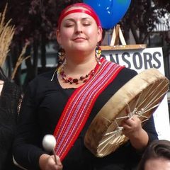 Chantal Stormsong Chagnon with a hand drum